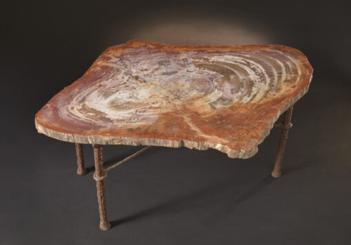 Rare Utah petrified wood table with warm colors and handcrafted design